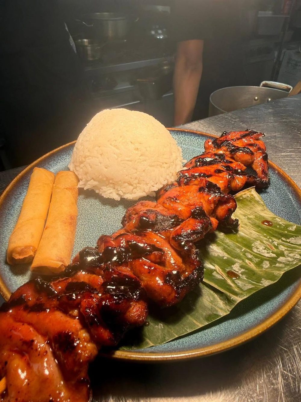 Grilled skewers with rice and spring rolls